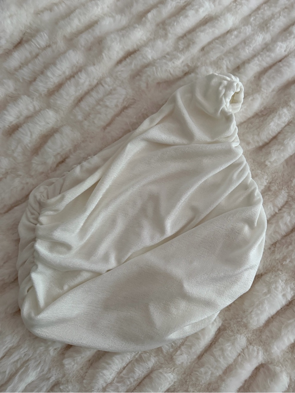 One shoulder white top